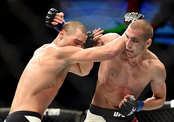 INGLEWOOD, CA - JUNE 04: Sean Strickland and Tom Breese of England exchange blows in their welterweight bout during the UFC 199 event at The Forum on June 4, 2016 in Inglewood, California. (Photo by Harry How/Zuffa LLC/Zuffa LLC via Getty Images)