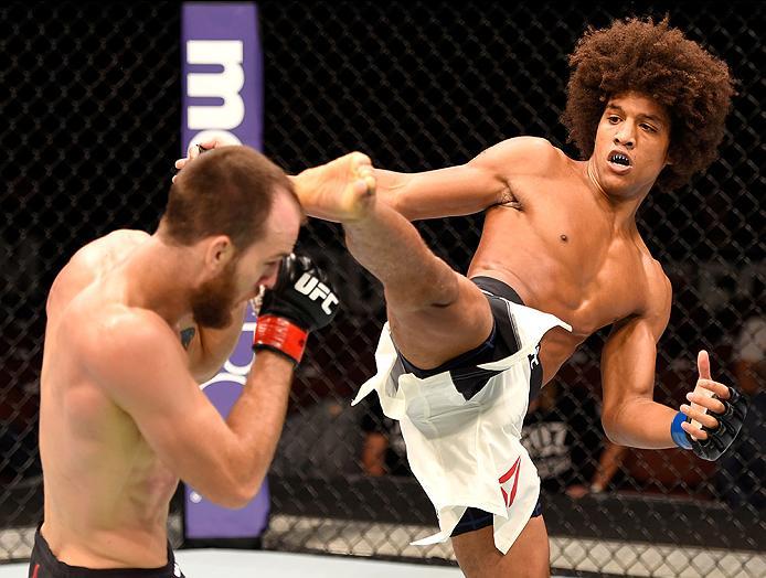 INGLEWOOD, CA - JUNE 04: Alex Caceres kicks Cole Miller in their featherweight bout during the UFC 199 event at The Forum on June 4, 2016 in Inglewood, California. (Photo by Josh Hedges/Zuffa LLC/Zuffa LLC via Getty Images)