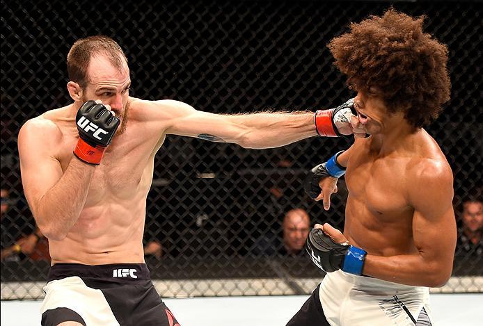 INGLEWOOD, CA - JUNE 04: Cole Miller punches Alex Caceres in their featherweight bout during the UFC 199 event at The Forum on June 4, 2016 in Inglewood, California. (Photo by Josh Hedges/Zuffa LLC/Zuffa LLC via Getty Images)