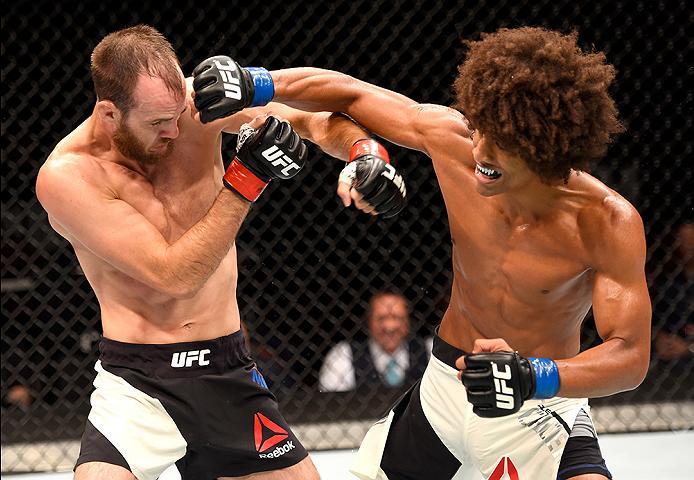 INGLEWOOD, CA - JUNE 04: Cole Miller and Alex Caceres exchange blows in their featherweight bout during the UFC 199 event at The Forum on June 4, 2016 in Inglewood, California. (Photo by Josh Hedges/Zuffa LLC/Zuffa LLC via Getty Images)
