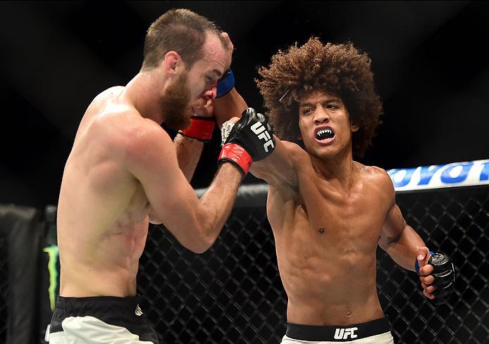 INGLEWOOD, CA - JUNE 04: Alex Caceres lands a right punch on Cole Miller in their featherweight bout during the UFC 199 event at The Forum on June 4, 2016 in Inglewood, California. (Photo by Harry How/Zuffa LLC/Zuffa LLC via Getty Images)