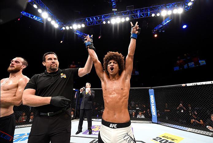 INGLEWOOD, CA - JUNE 04: Alex Caceres celebrates after defeating Cole Miller by unanimous decision in their featherweight bout during the UFC 199 event at The Forum on June 4, 2016 in Inglewood, California. (Photo by Josh Hedges/Zuffa LLC/Zuffa LLC via