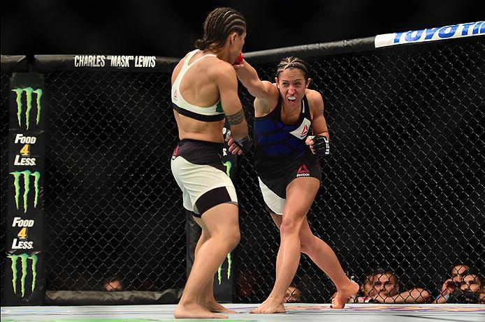 INGLEWOOD, CA - JUNE 04: Jessica Penne punches Jessica Andrade of Brazil in their women's strawweight bout during the UFC 199 event at The Forum on June 4, 2016 in Inglewood, California. (Photo by Harry How/Zuffa LLC/Zuffa LLC via Getty Images)