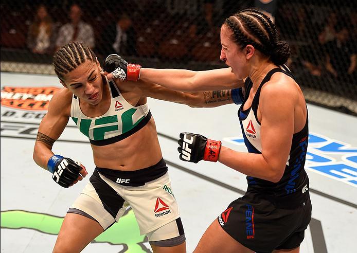INGLEWOOD, CA - JUNE 04: Jessica Andrade and Jessica Penne trade blows in their women's strawweight bout during the UFC 199 event at The Forum on June 4, 2016 in Inglewood, California. (Photo by Josh Hedges/Zuffa LLC/Zuffa LLC via Getty Images)