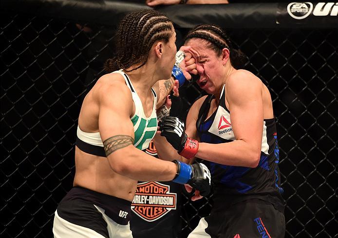 INGLEWOOD, CA - JUNE 04: Jessica Andrade lands a left to the face of Jessica Penne in their women's strawweight bout during the UFC 199 event at The Forum on June 4, 2016 in Inglewood, California. (Photo by Harry How/Zuffa LLC/Zuffa LLC via Getty Images