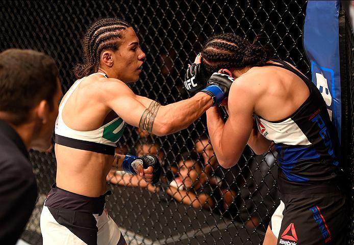 INGLEWOOD, CA - JUNE 04: Jessica Andrade of Brazil punches Jessica Penne in their women's strawweight bout during the UFC 199 event at The Forum on June 4, 2016 in Inglewood, California. (Photo by Josh Hedges/Zuffa LLC/Zuffa LLC via Getty Images)