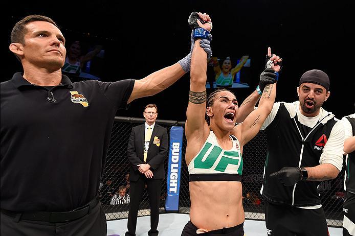 INGLEWOOD, CA - JUNE 04: Jessica Andrade of Brazil celebrates her win by TKO in the second round against Jessica Penne in their women's strawweight bout during the UFC 199 event at The Forum on June 4, 2016 in Inglewood, California. (Photo by Josh Hedge