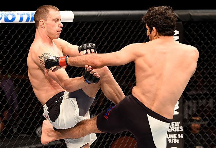 INGLEWOOD, CA - JUNE 04: James Vick and Beneil Darush of Iran exchange blows in their lightweight bout during the UFC 199 event at The Forum on June 4, 2016 in Inglewood, California. (Photo by Josh Hedges/Zuffa LLC/Zuffa LLC via Getty Images)