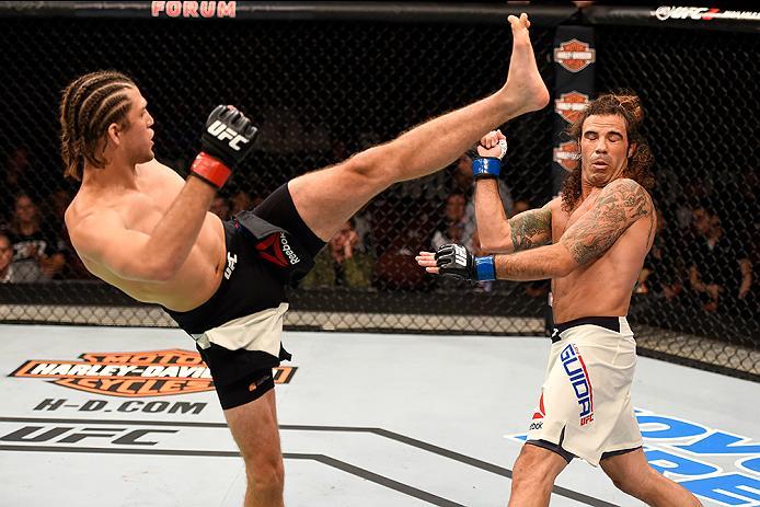 INGLEWOOD, CA - JUNE 04: Brian Ortega kicks Clay Guida in their featherweight bout during the UFC 199 event at The Forum on June 4, 2016 in Inglewood, California. (Photo by Josh Hedges/Zuffa LLC/Zuffa LLC via Getty Images)