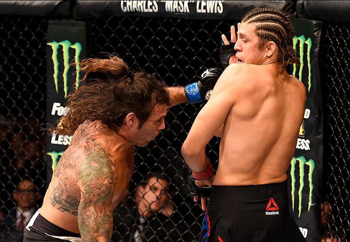 INGLEWOOD, CA - JUNE 04: Clay Guida punches Brian Ortega in their featherweight bout during the UFC 199 event at The Forum on June 4, 2016 in Inglewood, California. (Photo by Josh Hedges/Zuffa LLC/Zuffa LLC via Getty Images)