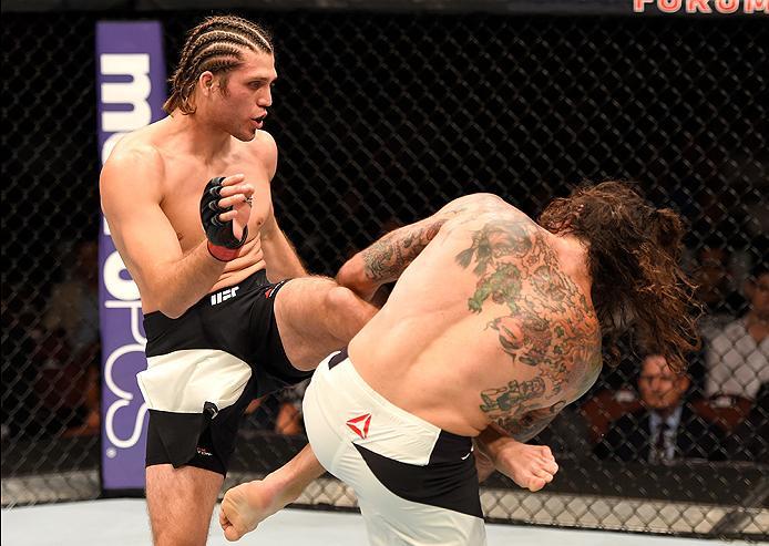 INGLEWOOD, CA - JUNE 04: Brian Ortega kicks Clay Guida in their featherweight bout during the UFC 199 event at The Forum on June 4, 2016 in Inglewood, California. (Photo by Josh Hedges/Zuffa LLC/Zuffa LLC via Getty Images)