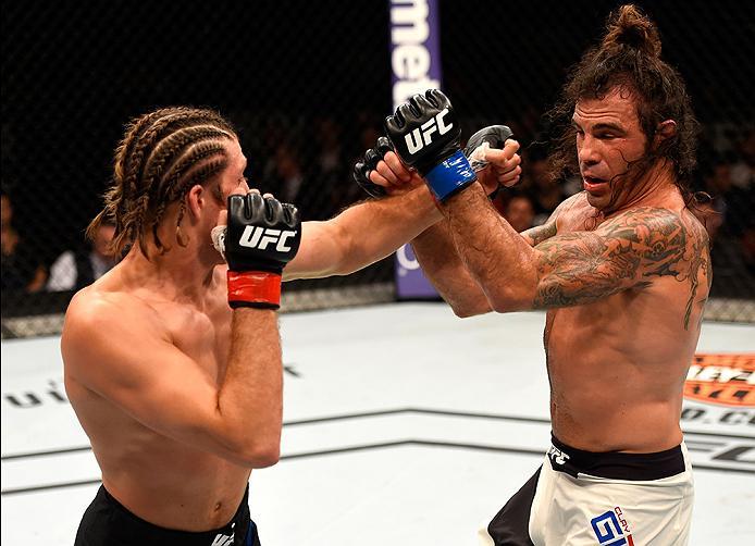 INGLEWOOD, CA - JUNE 04: Brian Ortega punches Clay Guida in their featherweight bout during the UFC 199 event at The Forum on June 4, 2016 in Inglewood, California. (Photo by Josh Hedges/Zuffa LLC/Zuffa LLC via Getty Images)