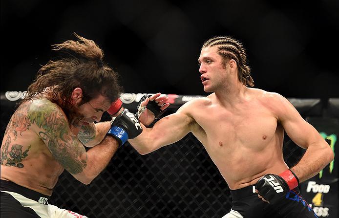 INGLEWOOD, CA - JUNE 04: Brian Ortega punches Clay Guida in their featherweight bout during the UFC 199 event at The Forum on June 4, 2016 in Inglewood, California. (Photo by Harry How/Zuffa LLC/Zuffa LLC via Getty Images)