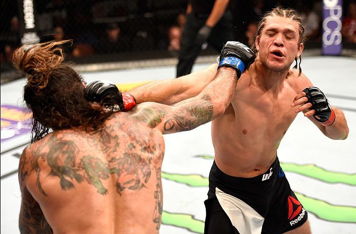 INGLEWOOD, CA - JUNE 04: Clay Guida and Brian Ortega exchange blows in their featherweight bout during the UFC 199 event at The Forum on June 4, 2016 in Inglewood, California. (Photo by Josh Hedges/Zuffa LLC/Zuffa LLC via Getty Images)