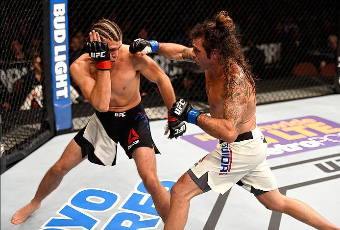INGLEWOOD, CA - JUNE 04: Clay Guida punches Brian Ortega in their featherweight bout during the UFC 199 event at The Forum on June 4, 2016 in Inglewood, California. (Photo by Josh Hedges/Zuffa LLC/Zuffa LLC via Getty Images)
