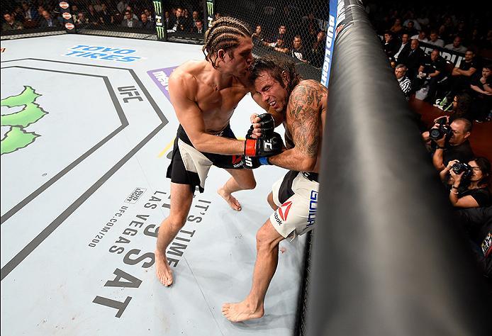 INGLEWOOD, CA - JUNE 04: Brian Ortega punches Clay Guida in their featherweight bout during the UFC 199 event at The Forum on June 4, 2016 in Inglewood, California. (Photo by Josh Hedges/Zuffa LLC/Zuffa LLC via Getty Images)