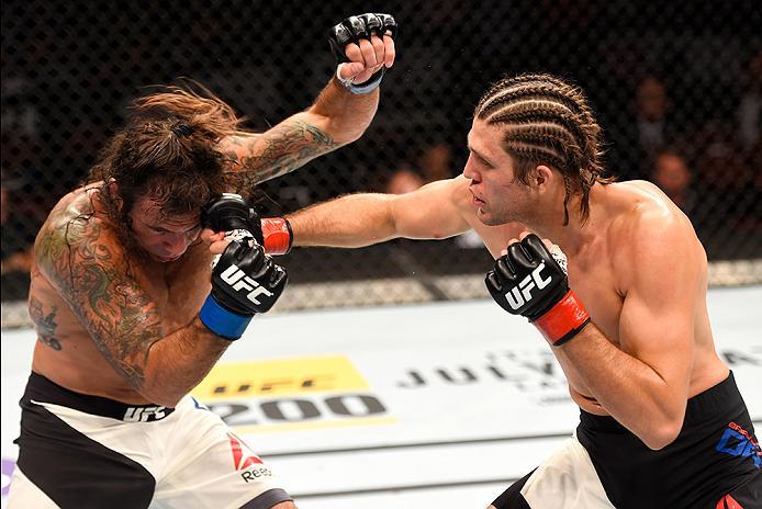 INGLEWOOD, CA - JUNE 04: Brian Ortega punches Clay Guida in their featherweight bout during the UFC 199 event at The Forum on June 4, 2016 in Inglewood, California. (Photo by Josh Hedges/Zuffa LLC/Zuffa LLC via Getty Images)