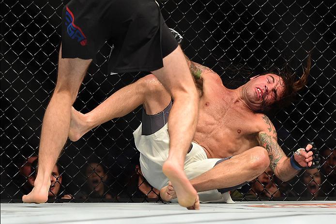 INGLEWOOD, CA - JUNE 04: Brian Ortega punches Clay Guida in their featherweight bout during the UFC 199 event at The Forum on June 4, 2016 in Inglewood, California. (Photo by Harry How/Zuffa LLC/Zuffa LLC via Getty Images)