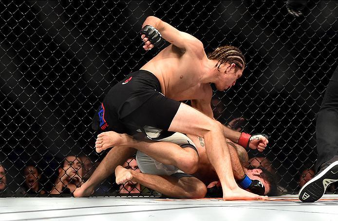 INGLEWOOD, CA - JUNE 04: Brian Ortega punches Clay Guida in their featherweight bout during the UFC 199 event at The Forum on June 4, 2016 in Inglewood, California. (Photo by Harry How/Zuffa LLC/Zuffa LLC via Getty Images)