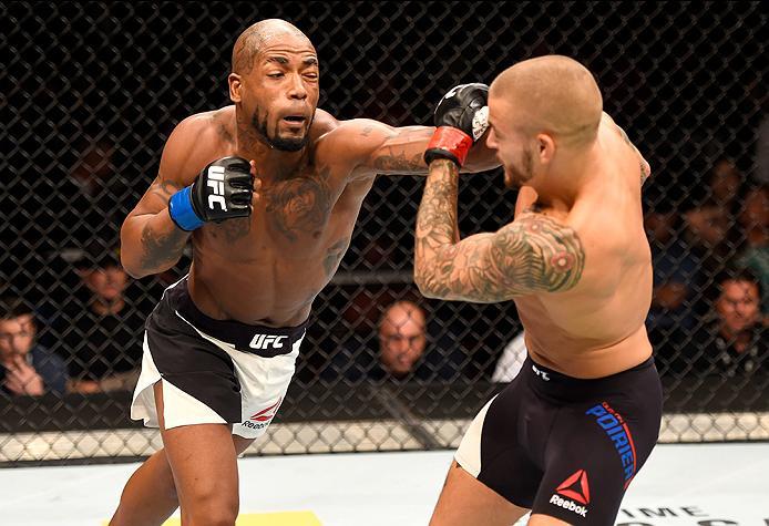 INGLEWOOD, CA - JUNE 04: Bobby Green punches Dustin Poirier in their lightweight bout during the UFC 199 event at The Forum on June 4, 2016 in Inglewood, California. (Photo by Josh Hedges/Zuffa LLC/Zuffa LLC via Getty Images)