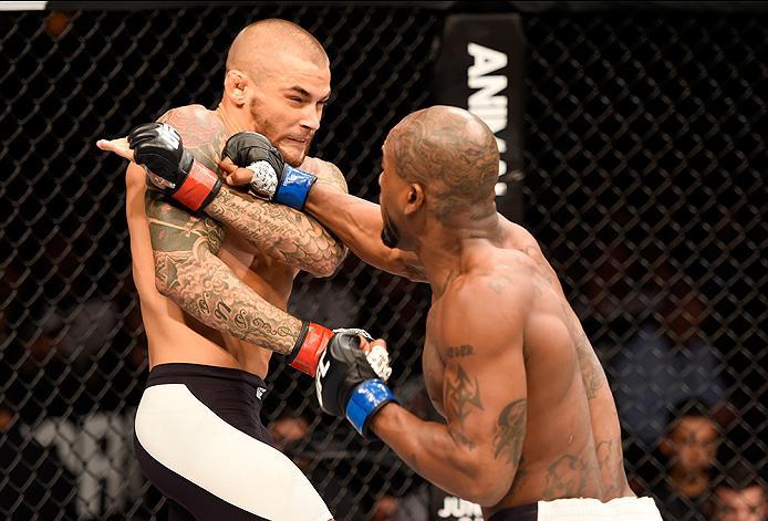INGLEWOOD, CA - JUNE 04: Bobby Green punches Dustin Poirier in their lightweight bout during the UFC 199 event at The Forum on June 4, 2016 in Inglewood, California. (Photo by Josh Hedges/Zuffa LLC/Zuffa LLC via Getty Images)