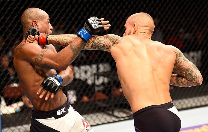 INGLEWOOD, CA - JUNE 04: Dustin Poirier punches Bobby Green in their lightweight bout during the UFC 199 event at The Forum on June 4, 2016 in Inglewood, California. (Photo by Josh Hedges/Zuffa LLC/Zuffa LLC via Getty Images)