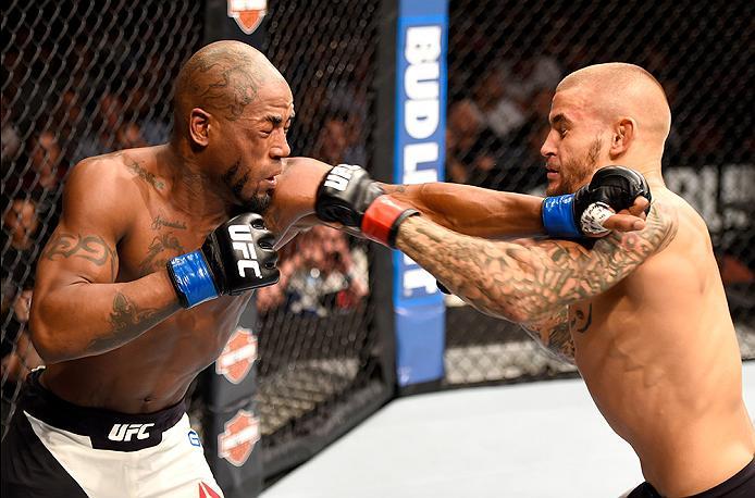 INGLEWOOD, CA - JUNE 04: Bobby Green and Dustin Poirier exchange blows in their lightweight bout during the UFC 199 event at The Forum on June 4, 2016 in Inglewood, California. (Photo by Josh Hedges/Zuffa LLC/Zuffa LLC via Getty Images)