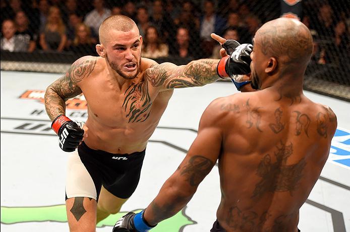 INGLEWOOD, CA - JUNE 04: Dustin Poirier punches Bobby Green in their lightweight bout during the UFC 199 event at The Forum on June 4, 2016 in Inglewood, California. (Photo by Josh Hedges/Zuffa LLC/Zuffa LLC via Getty Images)