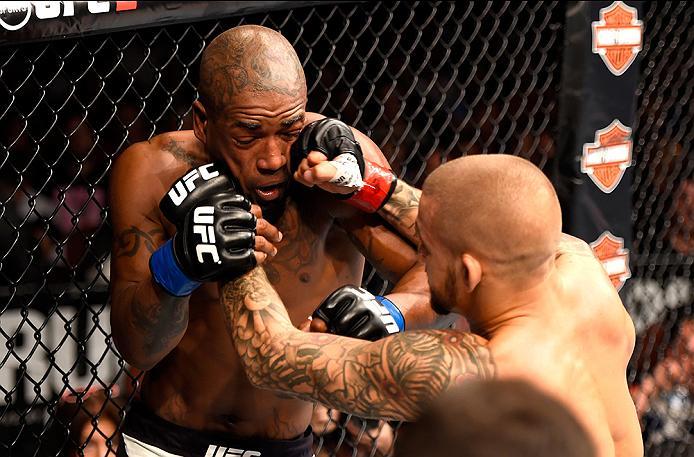 INGLEWOOD, CA - JUNE 04: Dustin Poirier punches Bobby Green in their lightweight bout during the UFC 199 event at The Forum on June 4, 2016 in Inglewood, California. (Photo by Josh Hedges/Zuffa LLC/Zuffa LLC via Getty Images)