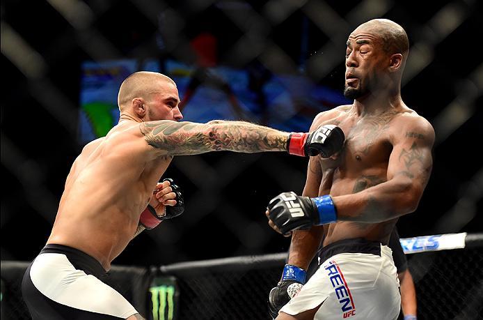 INGLEWOOD, CA - JUNE 04: Dustin Poirier punches Bobby Green in their lightweight bout during the UFC 199 event at The Forum on June 4, 2016 in Inglewood, California. (Photo by Harry How/Zuffa LLC/Zuffa LLC via Getty Images)