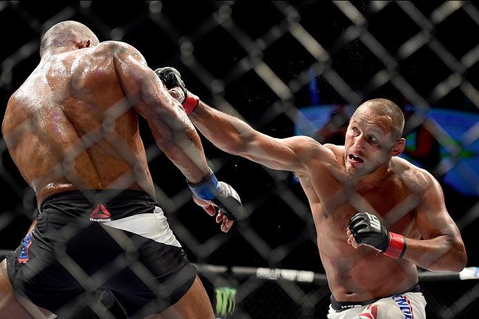 INGLEWOOD, CA - JUNE 04: Dan Henderson punches Hector Lombard of Cuba in their middleweight bout during the UFC 199 event at The Forum on June 4, 2016 in Inglewood, California. (Photo by Harry How/Zuffa LLC/Zuffa LLC via Getty Images)