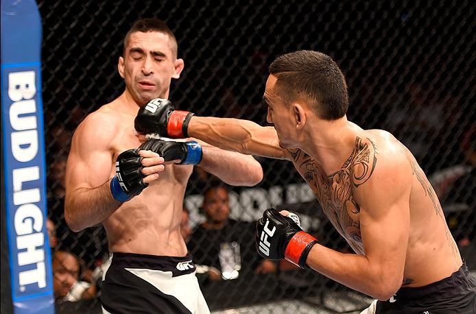 INGLEWOOD, CA - JUNE 04: Max Holloway lands a right punch on Ricardo Lamas in their featherweight bout during the UFC 199 event at The Forum on June 4, 2016 in Inglewood, California. (Photo by Josh Hedges/Zuffa LLC/Zuffa LLC via Getty Images)