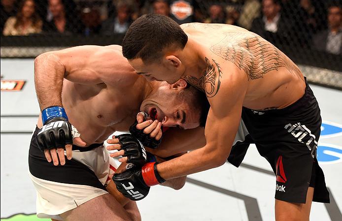 INGLEWOOD, CA - JUNE 04: Max Holloway and Ricardo Lamas tussle in their featherweight bout during the UFC 199 event at The Forum on June 4, 2016 in Inglewood, California. (Photo by Josh Hedges/Zuffa LLC/Zuffa LLC via Getty Images)