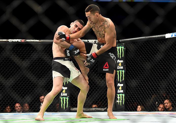 INGLEWOOD, CA - JUNE 04: Ricardo Lamas holds Max Holloways right leg in their featherweight bout during the UFC 199 event at The Forum on June 4, 2016 in Inglewood, California. (Photo by Harry How/Zuffa LLC/Zuffa LLC via Getty Images)