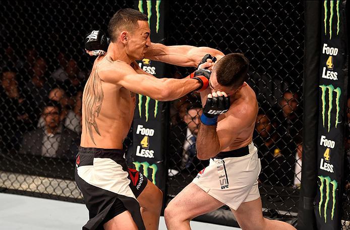 INGLEWOOD, CA - JUNE 04: Max Holloway and Ricardo Lamas exchange blows in their featherweight bout during the UFC 199 event at The Forum on June 4, 2016 in Inglewood, California. (Photo by Josh Hedges/Zuffa LLC/Zuffa LLC via Getty Images)