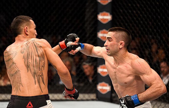 INGLEWOOD, CA - JUNE 04: Max Holloway and Ricardo Lamas exchange blows in their featherweight bout during the UFC 199 event at The Forum on June 4, 2016 in Inglewood, California. (Photo by Josh Hedges/Zuffa LLC/Zuffa LLC via Getty Images)