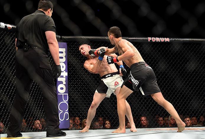 INGLEWOOD, CA - JUNE 04: Max Holloway lands a right punch to Ricardo Lamas in their featherweight bout during the UFC 199 event at The Forum on June 4, 2016 in Inglewood, California. (Photo by Harry How/Zuffa LLC/Zuffa LLC via Getty Images)