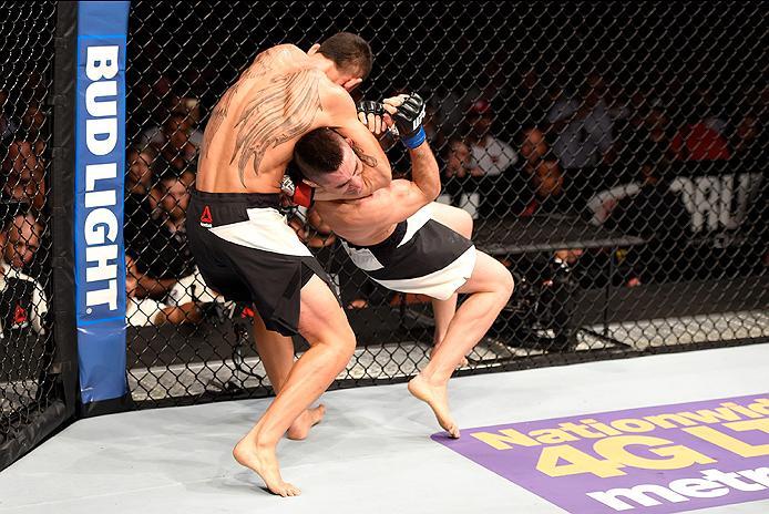 INGLEWOOD, CA - JUNE 04: Max Holloway wrestles Ricardo Lamas in their featherweight bout during the UFC 199 event at The Forum on June 4, 2016 in Inglewood, California. (Photo by Josh Hedges/Zuffa LLC/Zuffa LLC via Getty Images)