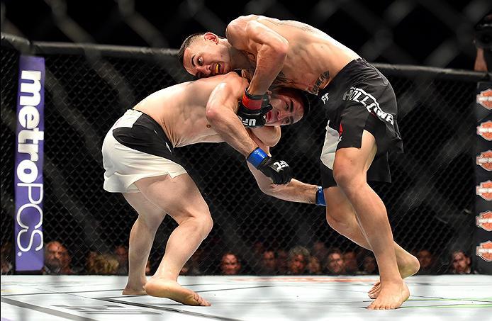 INGLEWOOD, CA - JUNE 04: Max Holloway wrestles Ricardo Lamas in their featherweight bout during the UFC 199 event at The Forum on June 4, 2016 in Inglewood, California. (Photo by Harry How/Zuffa LLC/Zuffa LLC via Getty Images)