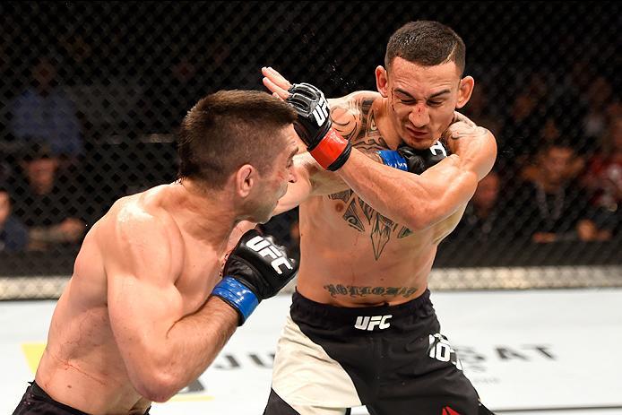 INGLEWOOD, CA - JUNE 04: Ricardo Lamas throws a left punch to Max Holloway in their featherweight bout during the UFC 199 event at The Forum on June 4, 2016 in Inglewood, California. (Photo by Josh Hedges/Zuffa LLC/Zuffa LLC via Getty Images)