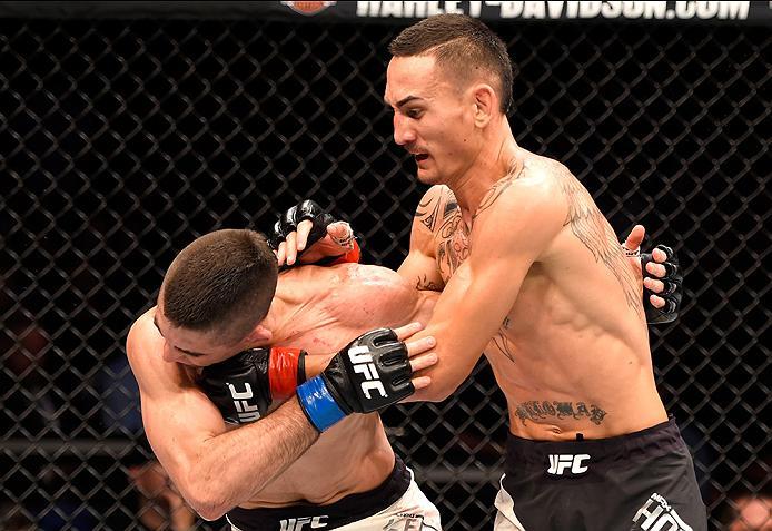 INGLEWOOD, CA - JUNE 04: Max Holloway punches Ricardo Lamas in their featherweight bout during the UFC 199 event at The Forum on June 4, 2016 in Inglewood, California. (Photo by Josh Hedges/Zuffa LLC/Zuffa LLC via Getty Images)
