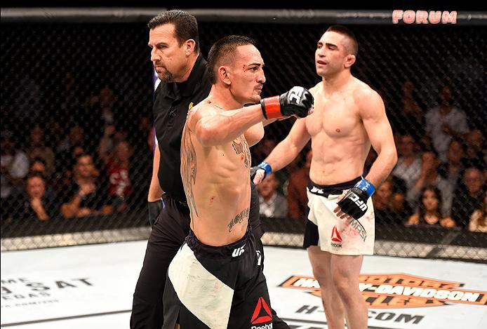 INGLEWOOD, CA - JUNE 04: Max Holloway celebrates after defeating Ricardo Lamas by unanimous decision in their featherweight bout during the UFC 199 event at The Forum on June 4, 2016 in Inglewood, California. (Photo by Josh Hedges/Zuffa LLC/Zuffa LLC vi