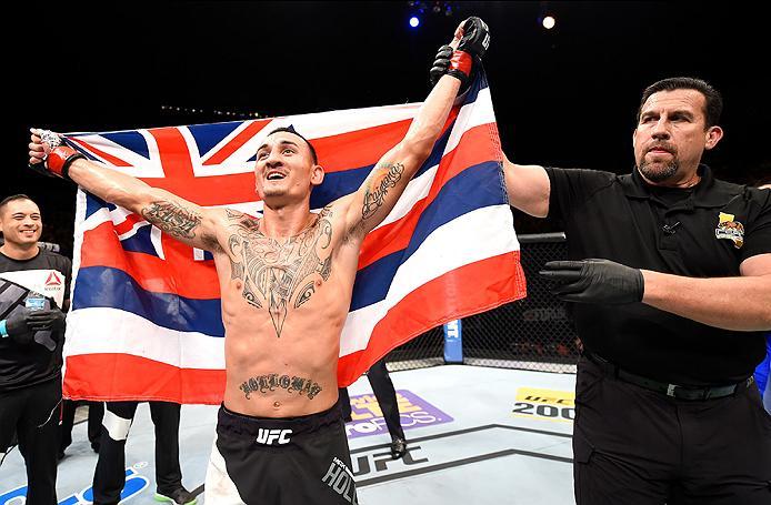 INGLEWOOD, CA - JUNE 04: Max Holloway celebrates after defeating Ricardo Lamas by unanimous decision in their featherweight bout during the UFC 199 event at The Forum on June 4, 2016 in Inglewood, California. (Photo by Josh Hedges/Zuffa LLC/Zuffa LLC via
