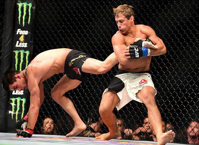 INGLEWOOD, CA - JUNE 04: Urijah Faber holds the leg of Dominick Cruz in their UFC bantamweight championship bout during the UFC 199 event at The Forum on June 4, 2016 in Inglewood, California. (Photo by Harry How/Zuffa LLC/Zuffa LLC via Getty Images)