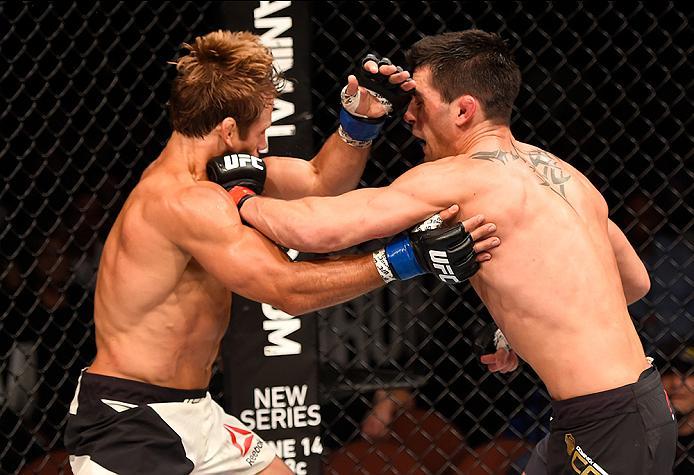 INGLEWOOD, CA - JUNE 04: Dominick Cruz throws a left punch at Urijah Faber in their UFC bantamweight championship bout during the UFC 199 event at The Forum on June 4, 2016 in Inglewood, California. (Photo by Josh Hedges/Zuffa LLC/Zuffa LLC via Getty Ima