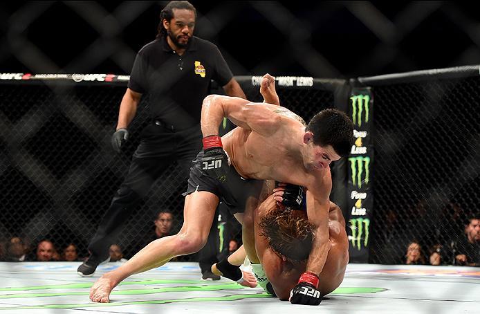 INGLEWOOD, CA - JUNE 04: Dominick Cruz punches Urijah Faber in their UFC bantamweight championship bout during the UFC 199 event at The Forum on June 4, 2016 in Inglewood, California. (Photo by Harry How/Zuffa LLC/Zuffa LLC via Getty Images)