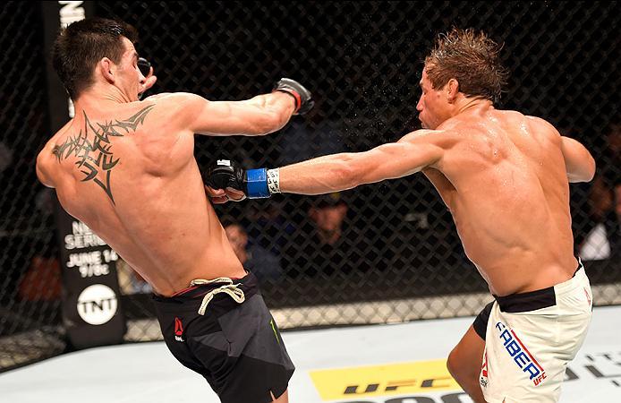 INGLEWOOD, CA - JUNE 04: Urijah Faber throws a left punch at Dominick Cruz in their UFC bantamweight championship bout during the UFC 199 event at The Forum on June 4, 2016 in Inglewood, California. (Photo by Josh Hedges/Zuffa LLC/Zuffa LLC via Getty Ima