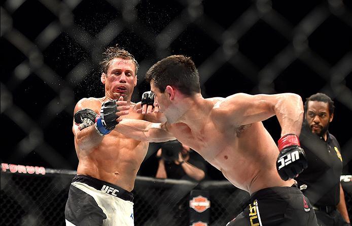 INGLEWOOD, CA - JUNE 04: Dominick Cruz throws a right punch at Urijah Faber in their UFC bantamweight championship bout during the UFC 199 event at The Forum on June 4, 2016 in Inglewood, California. (Photo by Harry How/Zuffa LLC/Zuffa LLC via Getty Ima