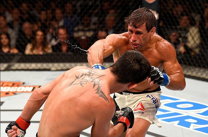 INGLEWOOD, CA - JUNE 04: Urijah Faber throws a right punch at Dominick Cruz in their UFC bantamweight championship bout during the UFC 199 event at The Forum on June 4, 2016 in Inglewood, California. (Photo by Josh Hedges/Zuffa LLC/Zuffa LLC via Getty I