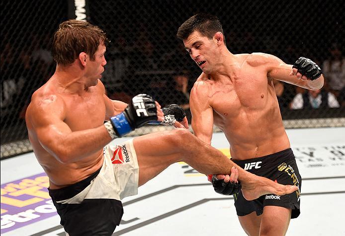 INGLEWOOD, CA - JUNE 04: Urijah Faber kicks Dominick Cruz in their UFC bantamweight championship bout during the UFC 199 event at The Forum on June 4, 2016 in Inglewood, California. (Photo by Josh Hedges/Zuffa LLC/Zuffa LLC via Getty Images)